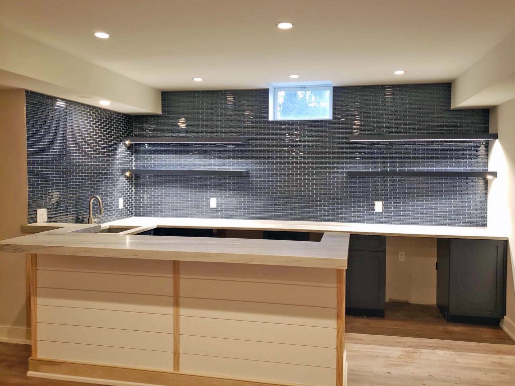 refurbished kitchen with black tile backsplash